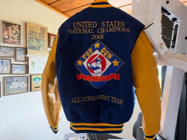 A national champions letterman jacket hung on a wall